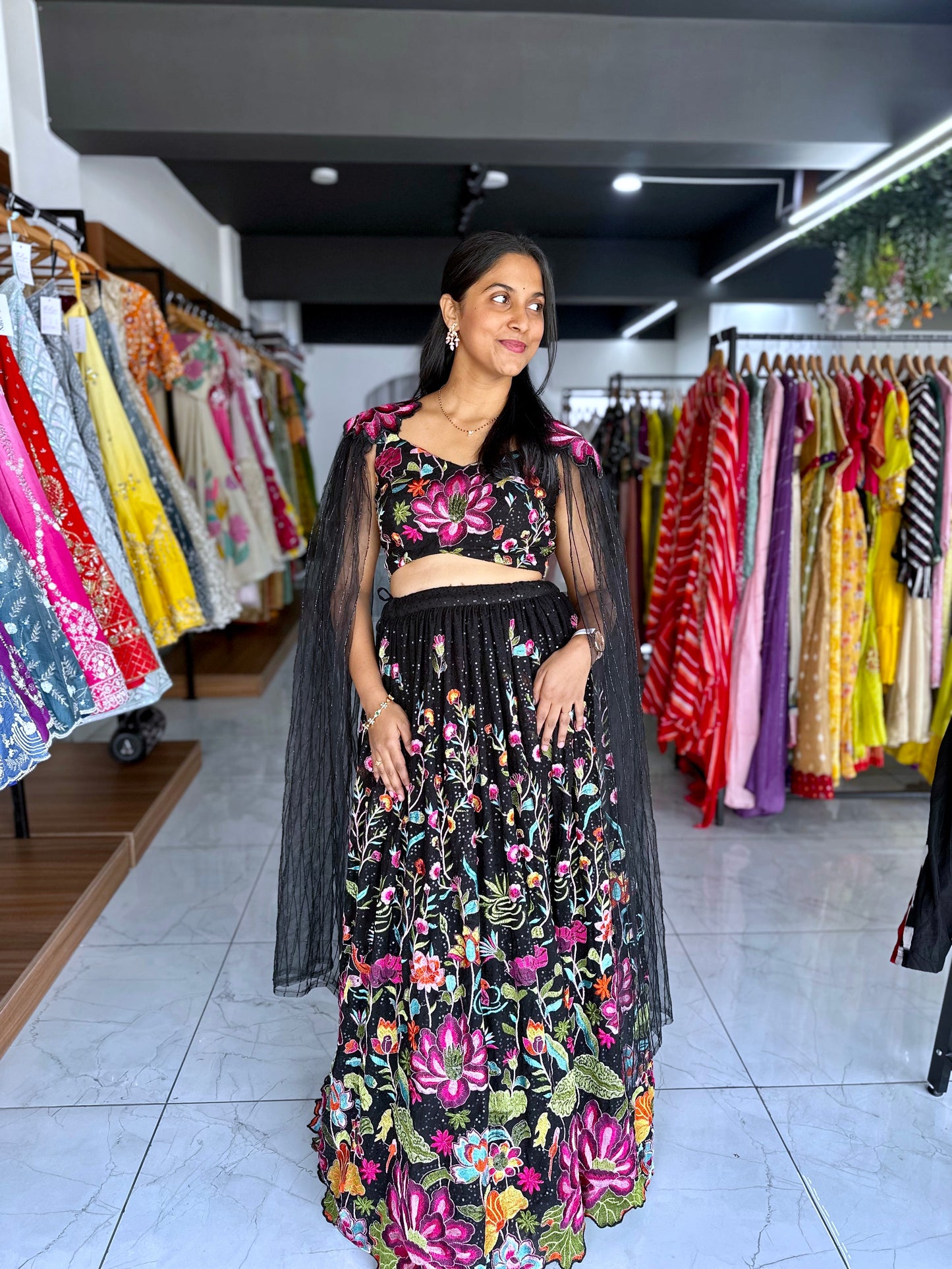 Black lehanga with angel sleeves and hand embroidey