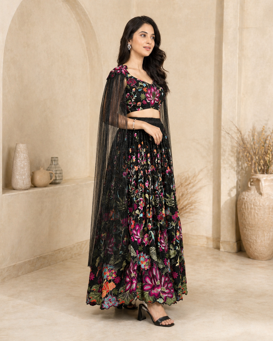 Black lehanga with angel sleeves and hand embroidey