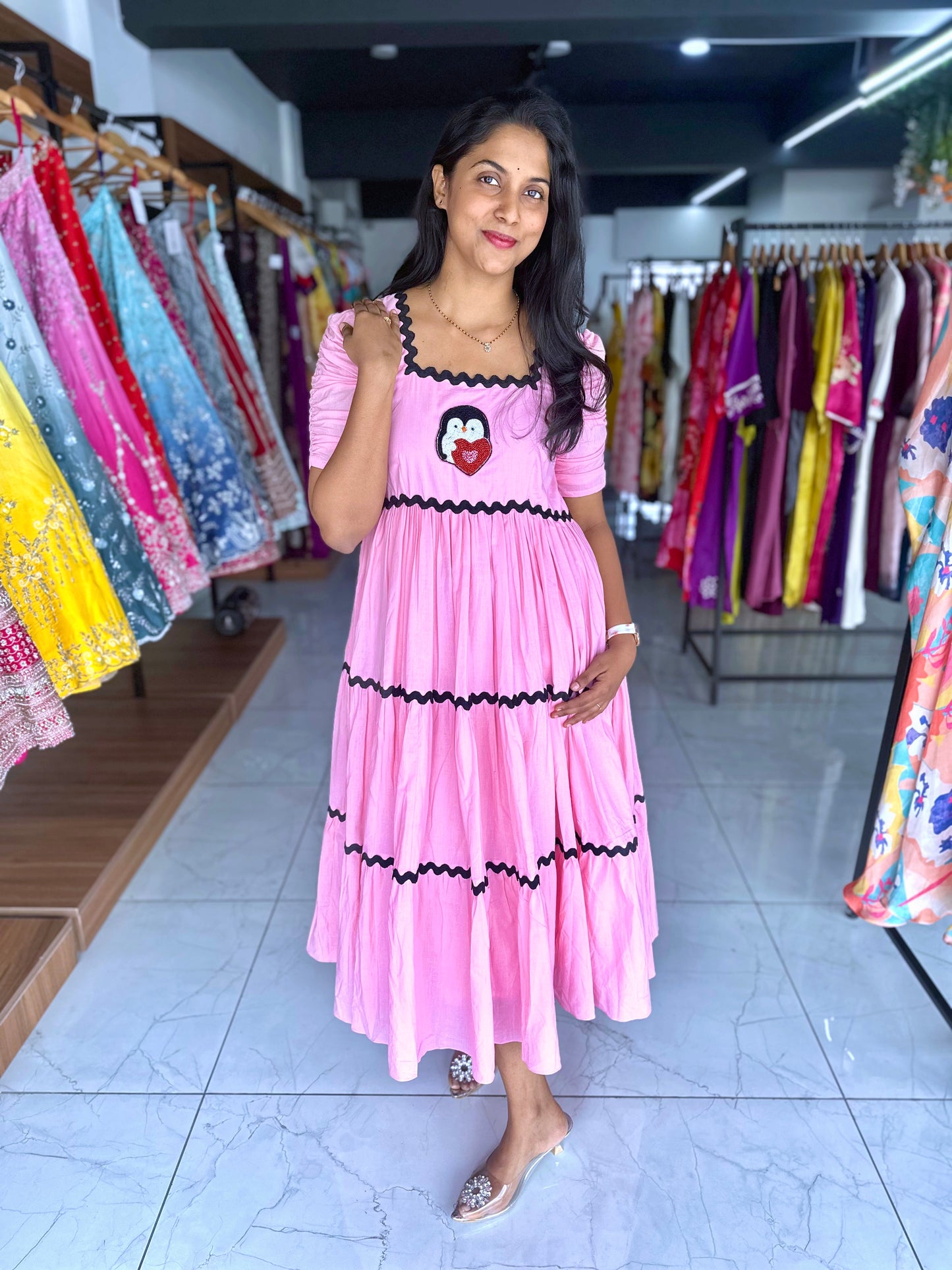 Pink cotton frock with a cute penguin motif