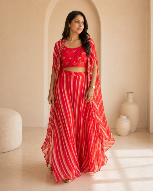 Red hand embroidered butti blouse and printed georgette lehanga and cape set