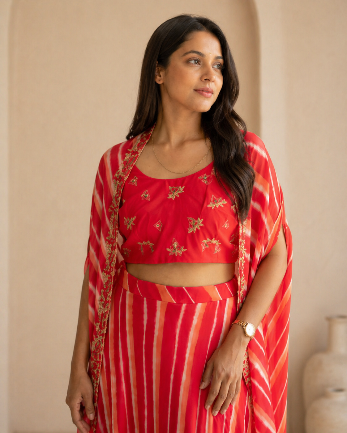 Red hand embroidered butti blouse and printed georgette lehanga and cape set
