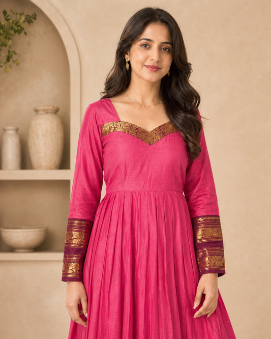 Pink cotton frock with kanchi border