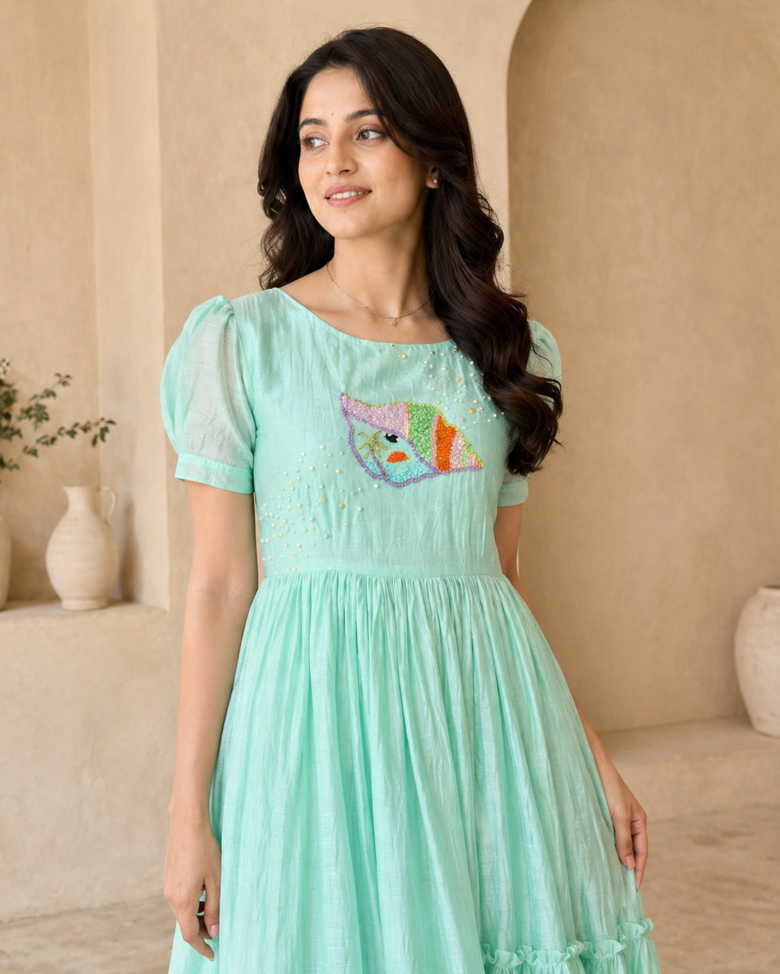 Pastel green frock with hand embroidery motif