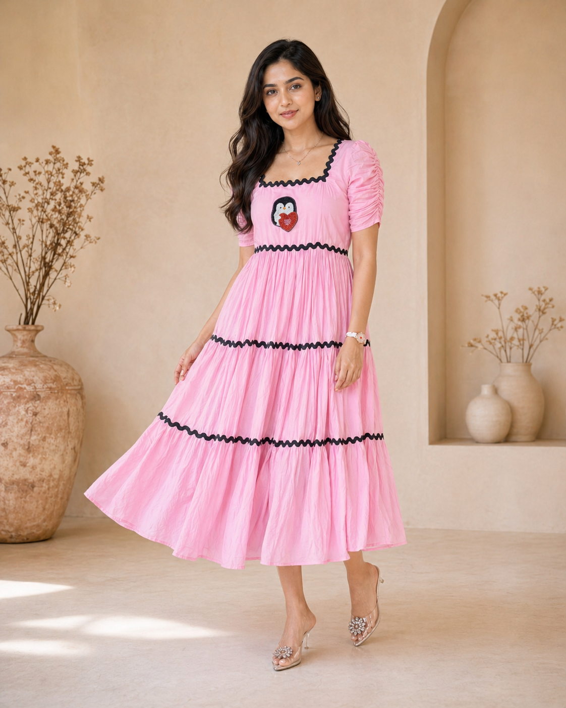 Pink cotton frock with a cute penguin motif